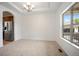 Dining area with carpeted floors with ample natural light and stainless refrigerator at 4400 S Ensenada St, Aurora, CO 80015