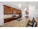 Bright kitchen with stainless steel appliances, granite countertops, and ample cabinet space at 4400 S Ensenada St, Aurora, CO 80015
