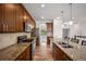 Updated kitchen featuring stainless steel appliances and a spacious granite countertop island at 4400 S Ensenada St, Aurora, CO 80015