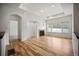 Bright and airy living room with hardwood floors, a fireplace, and ample natural light at 4400 S Ensenada St, Aurora, CO 80015