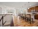 Bright and open living space adjacent to the kitchen, featuring hardwood floors and natural light at 4400 S Ensenada St, Aurora, CO 80015