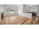 Hardwood floors, fireplace, and large windows highlight this open-concept living area at 4400 S Ensenada St, Aurora, CO 80015