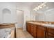 A bathroom with double sinks, vanity with great storage, and separate toilet room at 4400 S Ensenada St, Aurora, CO 80015