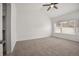 A spacious main bedroom with neutral carpet, vaulted ceiling, and ample natural light at 4400 S Ensenada St, Aurora, CO 80015