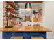 Basement wet bar with brick feature wall and wood countertop at 5224 Knobcone Dr, Castle Rock, CO 80108