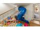 Fun play area with slide and toy storage at 5224 Knobcone Dr, Castle Rock, CO 80108