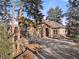 Two-story home with stone accents and a large driveway at 5224 Knobcone Dr, Castle Rock, CO 80108