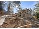 Two story house exterior with stone pathway and surrounding trees at 5224 Knobcone Dr, Castle Rock, CO 80108