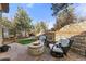 Cozy fire pit seating area on a flagstone patio at 5224 Knobcone Dr, Castle Rock, CO 80108