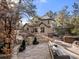 Stone patio with a hot tub and seating area at 5224 Knobcone Dr, Castle Rock, CO 80108