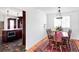 Elegant dining area with hardwood floors, a traditional table, and great views into the kitchen at 6705 Youngfield Ct, Arvada, CO 80004