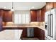 Modern kitchen featuring stainless steel appliances, granite countertops, and custom cabinetry at 6705 Youngfield Ct, Arvada, CO 80004