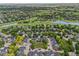 Stunning aerial view of the neighborhood with lush greenery, pond, and a golf course nearby at 2528 Concord Cir, Lafayette, CO 80026