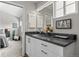 Modern bathroom featuring a white vanity with a dark countertop and a view to the bedroom at 2528 Concord Cir, Lafayette, CO 80026