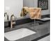 Modern bathroom featuring a white sink with a dark countertop at 2528 Concord Cir, Lafayette, CO 80026