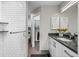 Stylish bathroom featuring a modern shower and a vanity with a dark countertop at 2528 Concord Cir, Lafayette, CO 80026