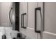 Close-up of gray kitchen cabinetry with modern black hardware and sleek design at 2528 Concord Cir, Lafayette, CO 80026