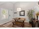 Dining area featuring a wooden table, hardwood floors, and a decorative mirror that enhances the room's charm at 2528 Concord Cir, Lafayette, CO 80026