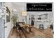 Inviting dining area flows into an updated kitchen with gray cabinets and stainless steel appliances, complemented by wooden floors at 2528 Concord Cir, Lafayette, CO 80026
