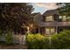 Charming home exterior with well-maintained landscaping, picket fence, and inviting curb appeal at 2528 Concord Cir, Lafayette, CO 80026