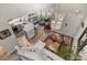 Open concept living room boasts hardwood floors, recessed lighting, and a modern kitchen island at 2528 Concord Cir, Lafayette, CO 80026