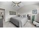 Bright main bedroom features a vaulted ceiling, a modern ceiling fan and oversized windows at 2528 Concord Cir, Lafayette, CO 80026