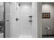 Modern shower with white subway tiles and sleek shelving at 2528 Concord Cir, Lafayette, CO 80026