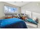 Bedroom featuring desk, chair and large window at 9291 Twenty Mile Rd # 106, Parker, CO 80134