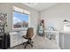 Bedroom with large window and sewing machines on table at 9291 Twenty Mile Rd # 106, Parker, CO 80134