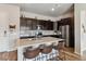 Modern kitchen with stainless steel appliances, granite countertops, and dark wood cabinets at 9291 Twenty Mile Rd # 106, Parker, CO 80134