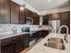 Well-equipped kitchen featuring stainless steel appliances, granite countertops, and modern cabinetry at 9291 Twenty Mile Rd # 106, Parker, CO 80134