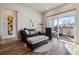 Cozy living room with modern furnishings and sliding door to private balcony at 9291 Twenty Mile Rd # 106, Parker, CO 80134