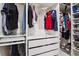 Spacious walk-in closet with custom shelving, hanging rods, and drawer storage for optimal organization at 9291 Twenty Mile Rd # 106, Parker, CO 80134