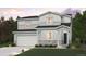 Charming two-story home featuring a two-car garage, stone accents, and a beautifully landscaped front yard at 4265 Gozzer Ranch Dr, Elizabeth, CO 80107