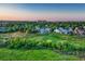 Beautiful aerial view of a neighborhood with lush greenery, well-maintained homes, and scenic surroundings at 1838 Mountain Daisy Ct, Highlands Ranch, CO 80129