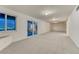 Large finished basement featuring neutral carpet, sliding glass doors to the outside, and recessed lighting at 1838 Mountain Daisy Ct, Highlands Ranch, CO 80129