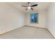 Carpeted bedroom with a ceiling fan, and window providing natural light at 1838 Mountain Daisy Ct, Highlands Ranch, CO 80129