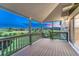 Spacious deck with wood flooring and railing offering panoramic views of the lush surroundings at 1838 Mountain Daisy Ct, Highlands Ranch, CO 80129