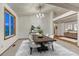 Bright dining room features a modern chandelier, stylish furniture, and neutral decor for comfortable living and entertaining at 1838 Mountain Daisy Ct, Highlands Ranch, CO 80129