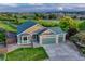 Aerial view features a well-maintained home with mature landscaping, a driveway, and a two car garage at 1838 Mountain Daisy Ct, Highlands Ranch, CO 80129