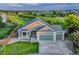Inviting two-story home with a three-car garage and lush, green surroundings at 1838 Mountain Daisy Ct, Highlands Ranch, CO 80129