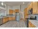 Updated kitchen with stainless steel appliances, stylish backsplash, and ample storage at 1838 Mountain Daisy Ct, Highlands Ranch, CO 80129