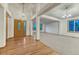 Bright living room with hardwood floors and large windows at 1838 Mountain Daisy Ct, Highlands Ranch, CO 80129
