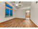 A bright main bedroom showcasing a vaulted ceiling, ceiling fan, and ensuite bathroom access at 1838 Mountain Daisy Ct, Highlands Ranch, CO 80129