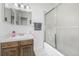 Cozy bathroom features tiled floors and a shower/tub combo at 4663 S Lowell Blvd, Denver, CO 80236