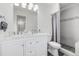 Elegant bathroom with a dual sink vanity, stylish shower, and modern fixtures at 4663 S Lowell Blvd, Denver, CO 80236