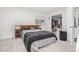 Comfortable bedroom with a large bed, closet, and a window bringing in natural light at 4663 S Lowell Blvd, Denver, CO 80236