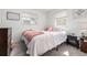 Comfortable bedroom featuring soft lighting, plush pillows, and a warm throw blanket at 4663 S Lowell Blvd, Denver, CO 80236