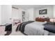 Comfortable bed with a stylish dresser, changing table, and easy access to the upstairs hallway at 4663 S Lowell Blvd, Denver, CO 80236