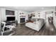 Inviting living room featuring wood floors, a fireplace and a large comfortable sofa at 4663 S Lowell Blvd, Denver, CO 80236